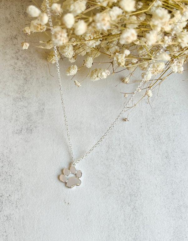 Elegant silver pendant with paw print on chain