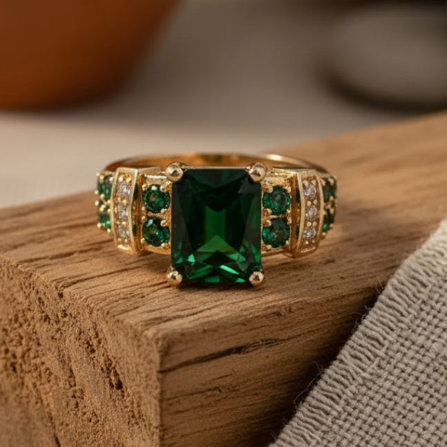 Gold ring with green crystal