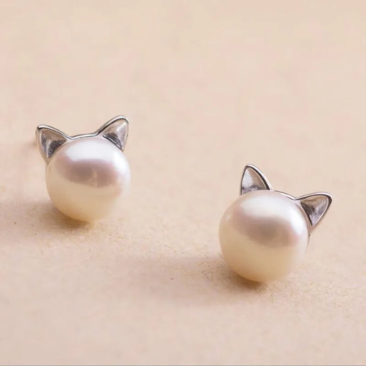 Silver earrings with a pearl and cat motif