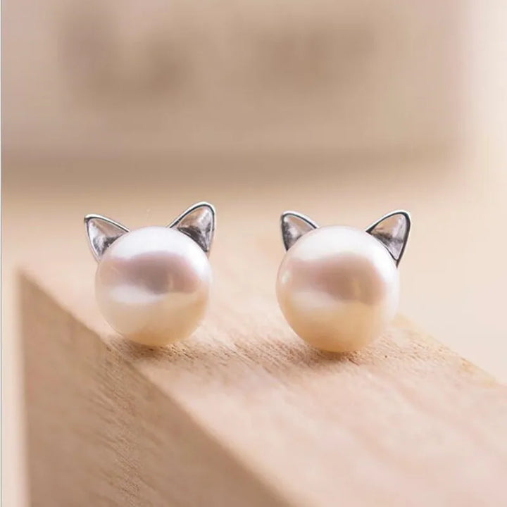 Silver earrings with a pearl and cat motif