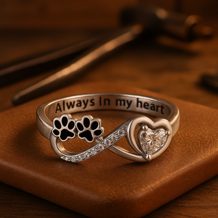 Ring with an open heart and an infinity symbol.