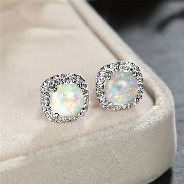 Elegant silver earrings with round white vuuropals