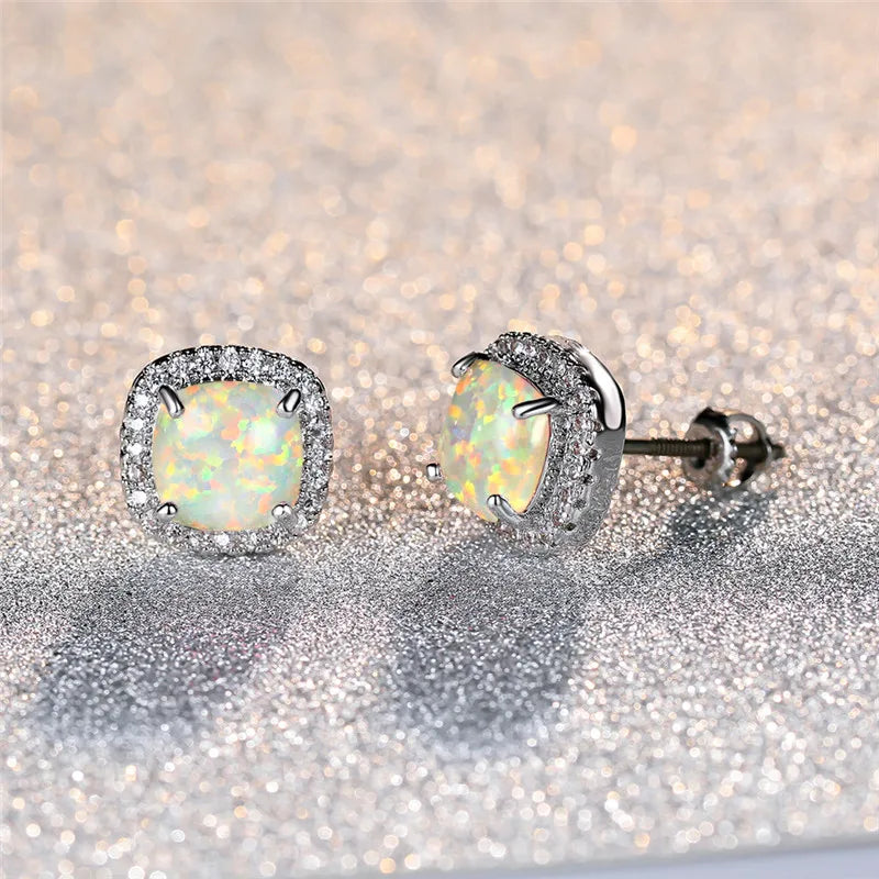 Elegant silver earrings with round white vuuropal