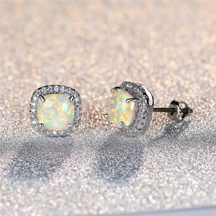 Elegant silver earrings with round white vuuropal