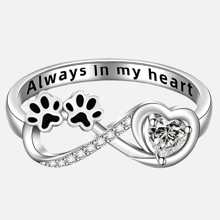 Ring with an open heart and an infinity symbol.