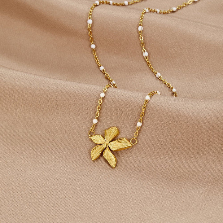 Elegant Necklace with a Golden Flower